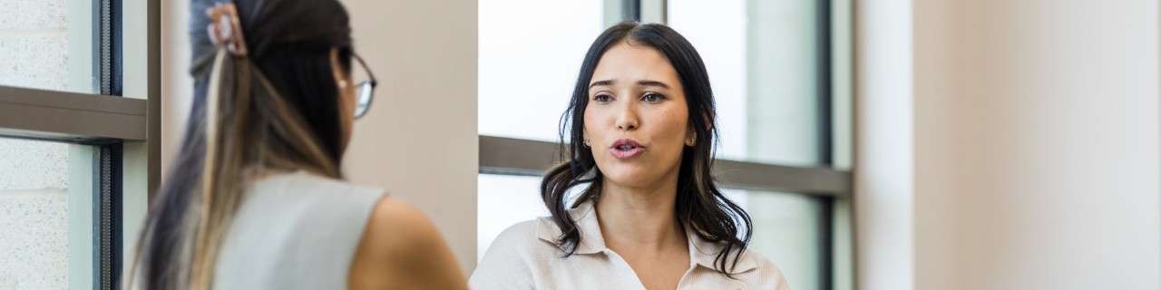 Two women talking to each other