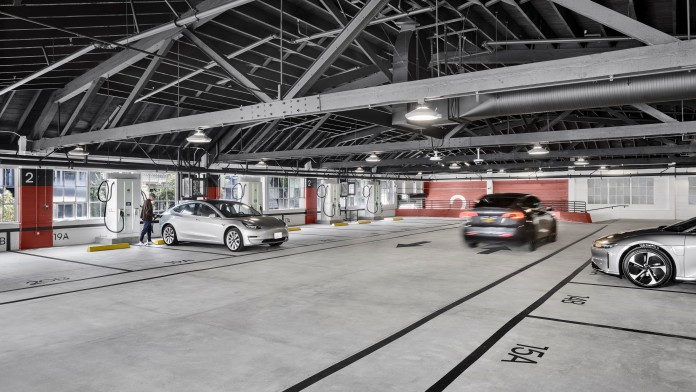 Car park with charging points and three cars